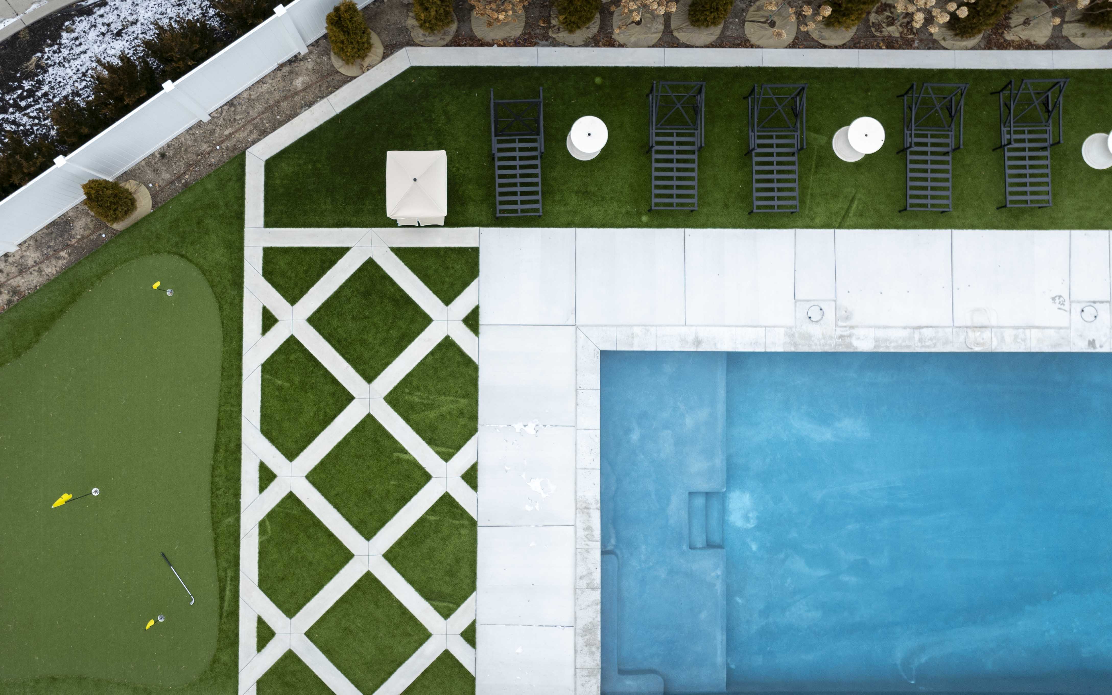 turf and lawn chairs by pool